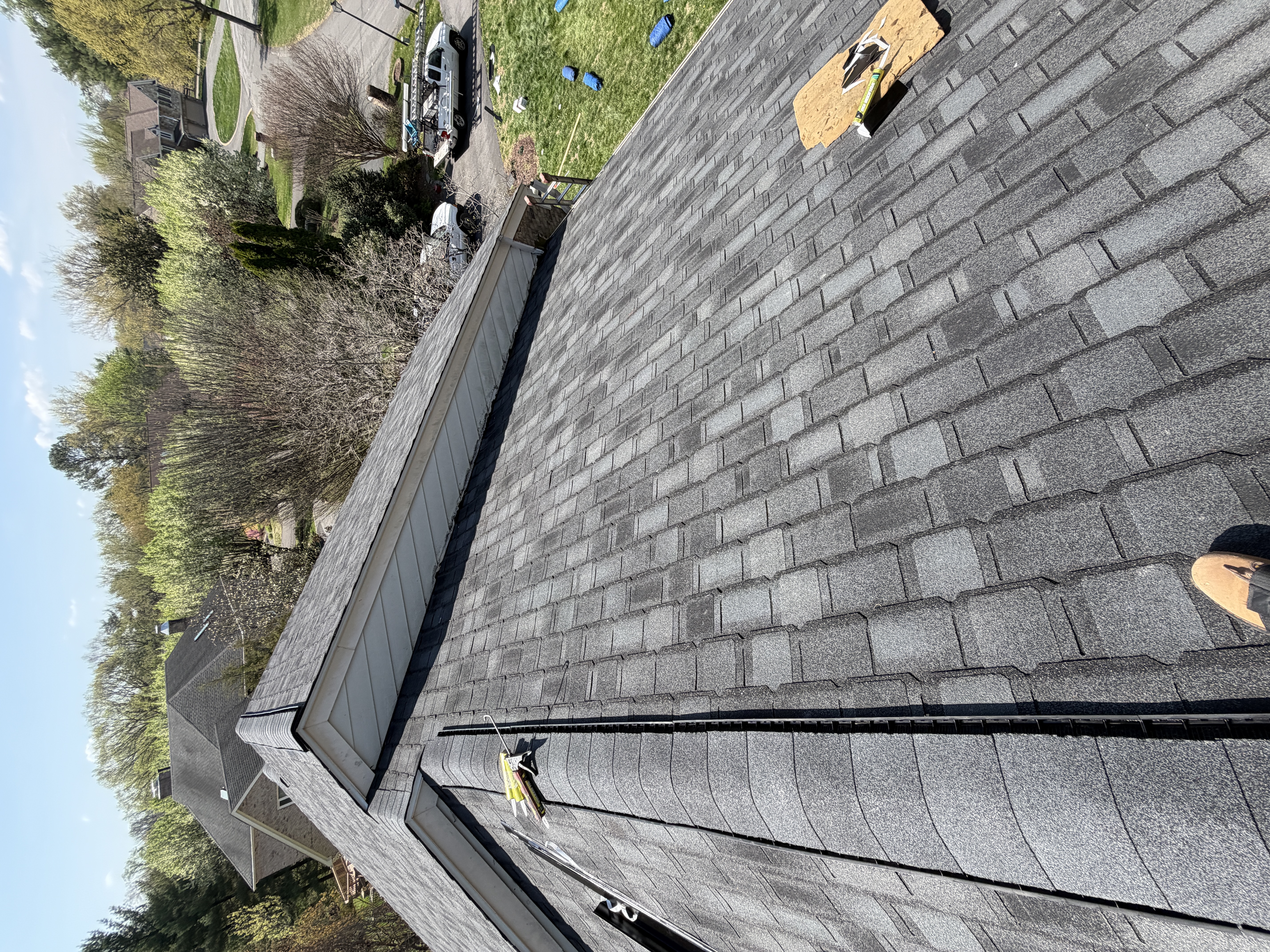 XRoofer crew working on a residential roof installation