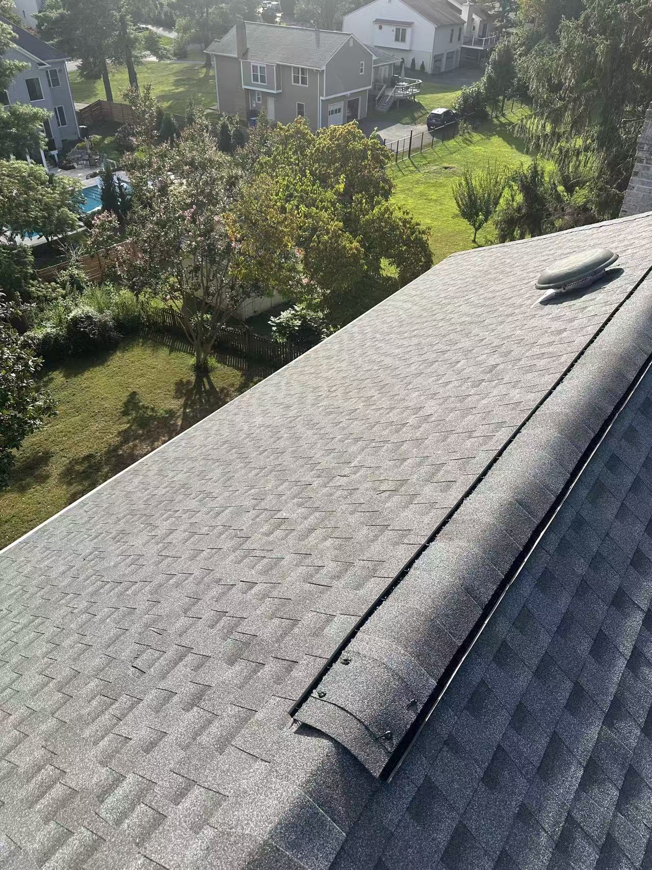 Aerial view of completed shingle roof installation